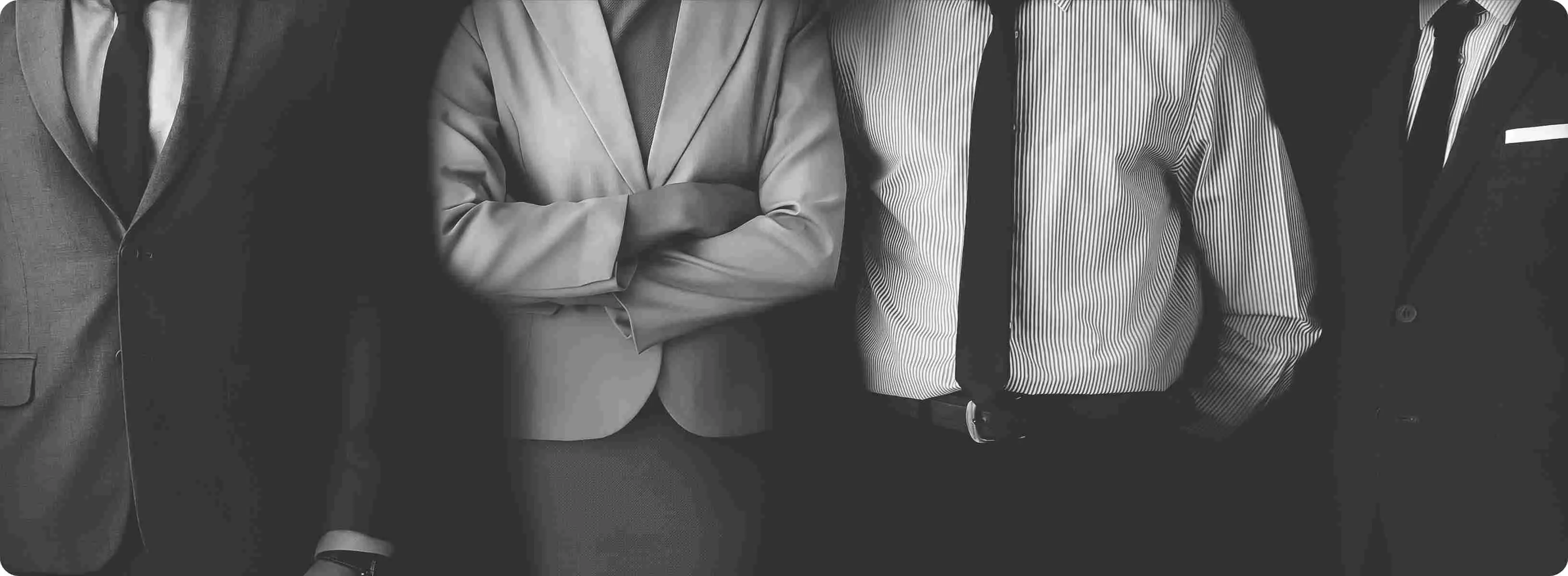 Enrich Money team members standing together at work